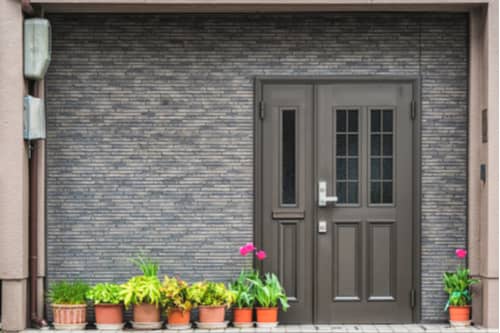 Gray front door with decorative square windows, replacement doors in Charlotte concept